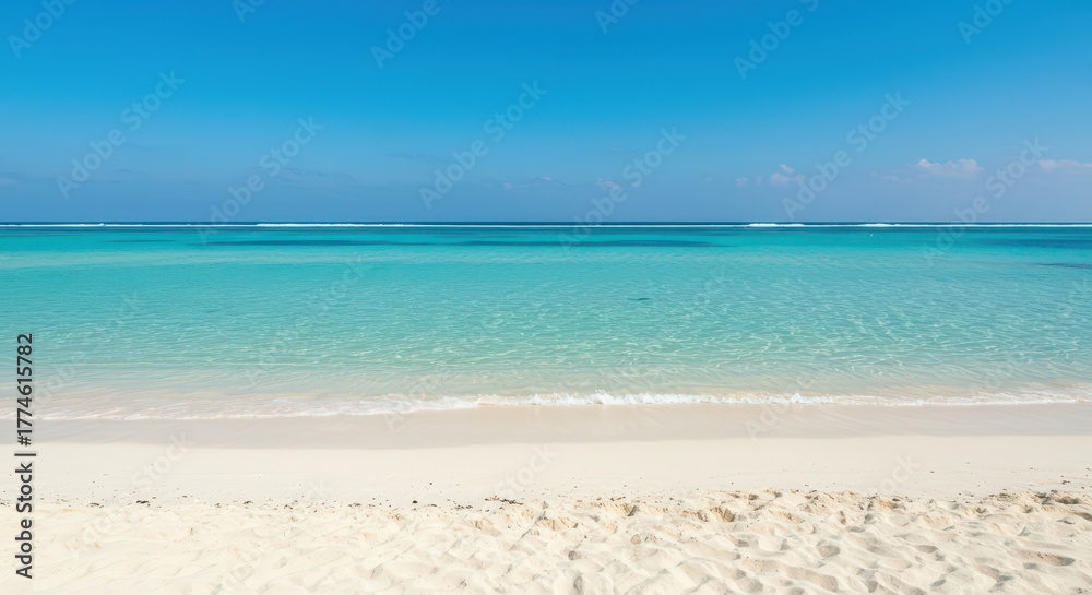 Fototapeta premium Idyllic tropical beach scene featuring white sand and crystal clear turquoise ocean water under bright summer sunlight, white sand, Holiday, beach