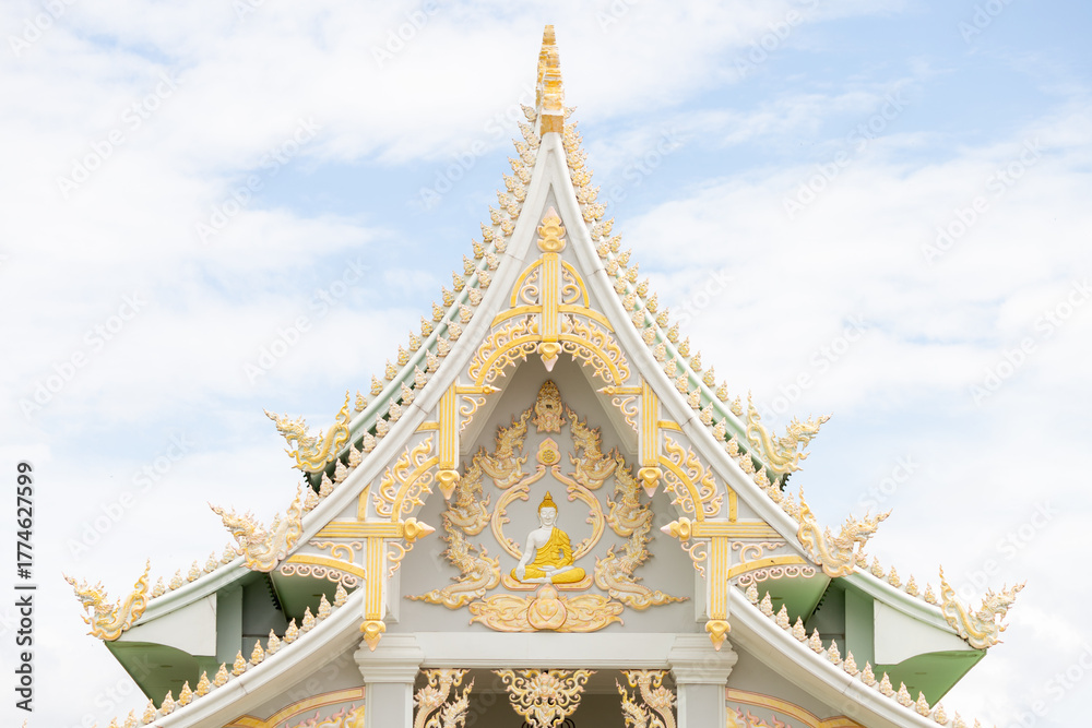Naklejka premium thai temple gable with golden buddhist relief