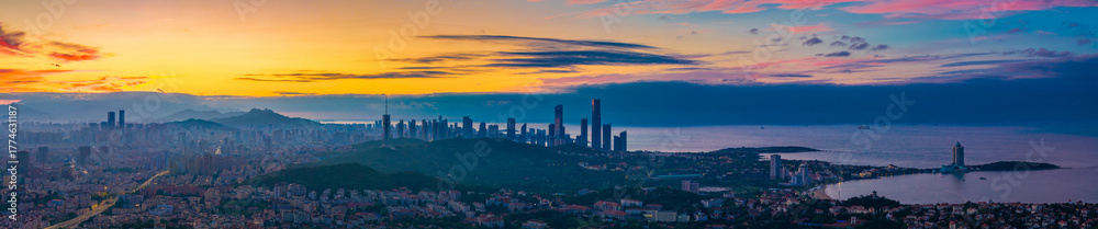 Fototapeta premium Cityscape at dawn in Qingdao, China