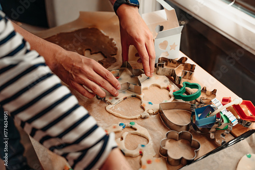 Hands Cutting Cookie Shapes from Rolled Dough