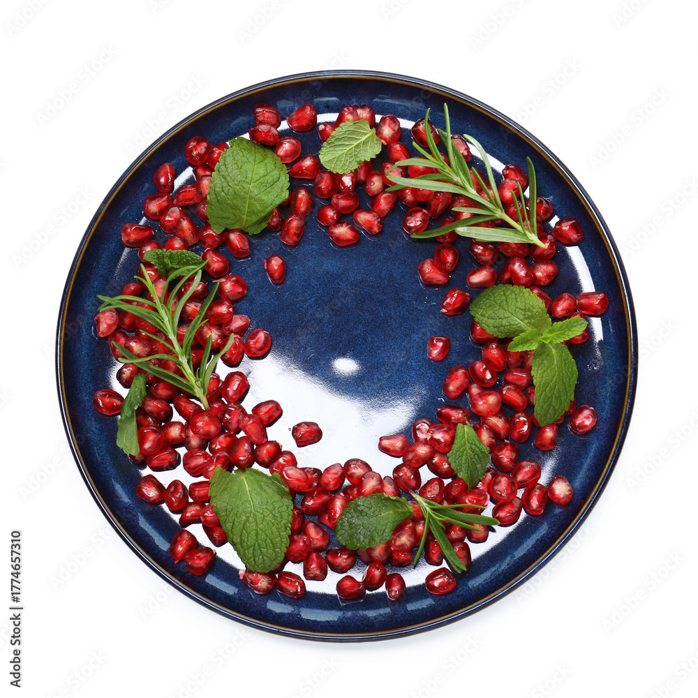 Obraz premium Christmas food. Pomegranate seeds, mint and rosemary isolated on white, top view
