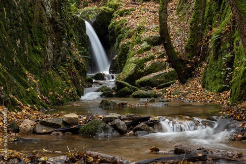 Beautiful Waterfall in Vibrant Autumn Forest