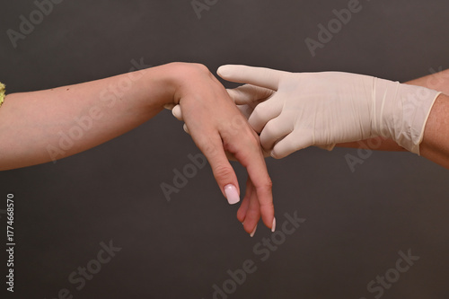 fluid filled ganglion around wrist joint. cyst on arm requires attention. concept of hygroma treatment and examination. Wrist ganglion cyst appears as soft swelling on joint. on grey background