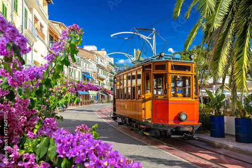 Island of Mallorca. Colorful  tramway links the inland town of Soller to Port de Soller, running along the beach-side road.