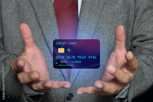 Businessman hand holding Credit card, for online financial transaction, Mobile banking, Bank payment, Shopping. Online financial institution for customers around the world.