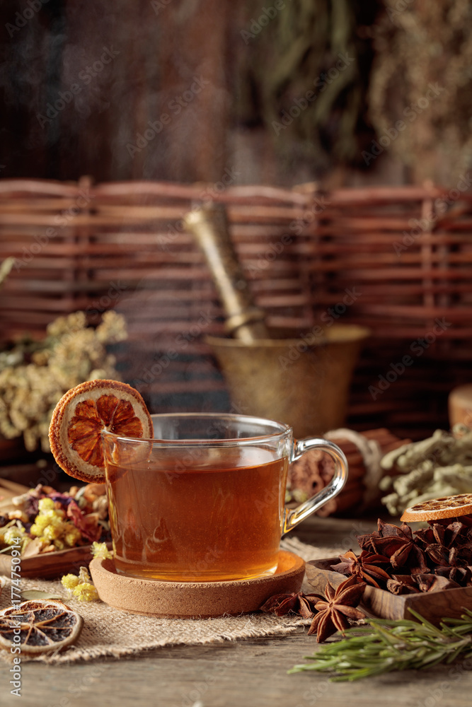 Fototapeta premium Tea with ingredients and slices of dried oranges.