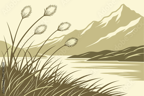 Cotton grass near lake shore with mountain backdrop in Denali Park