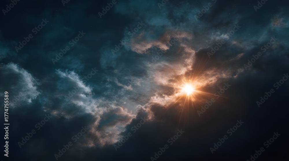 Fototapeta premium A bright sun with intense rays breaks through dark dramatic clouds at dawn creating a powerful natural spectacle