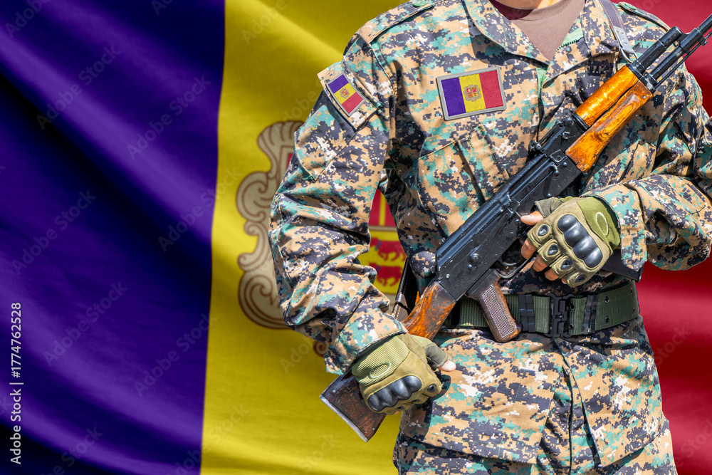 Fototapeta premium Andorra flag with soldier in military uniform holding assault rifle in front of it
