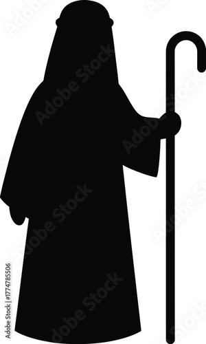 Silhouette of a shepherd holding a crook staff