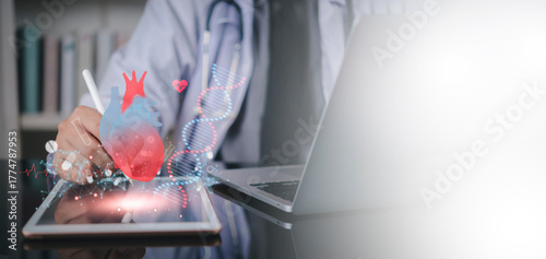 Photos Cardiologist working on tablet with virtual heart, DNA hologram