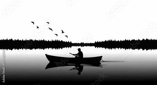 Silhouette of a lone person paddling a canoe on a calm lake.