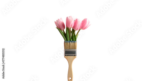 A paint brush with pink tulips growing from it against a stark black background