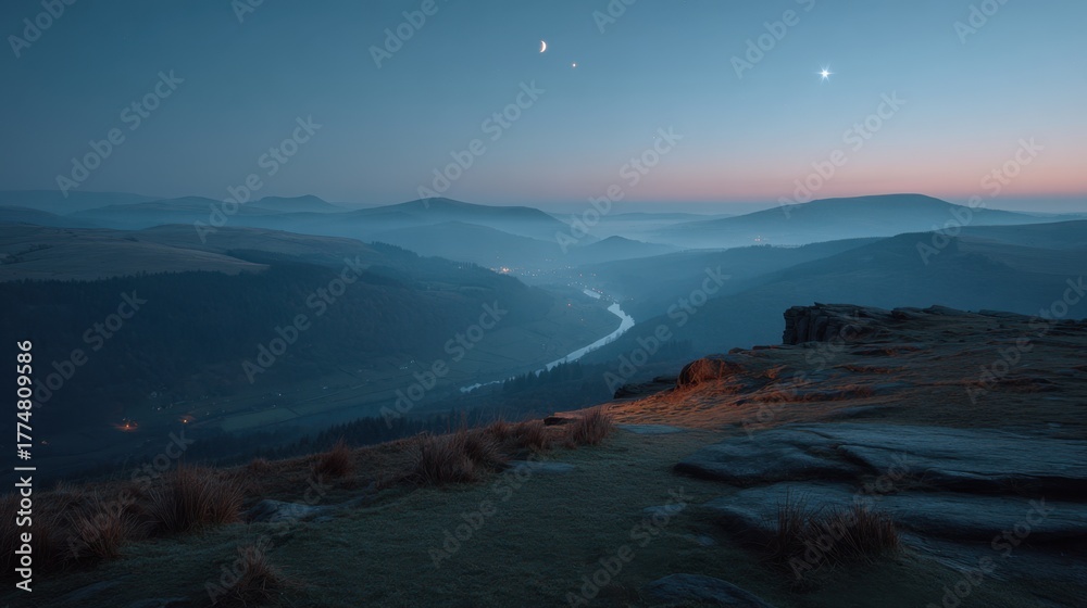 Naklejka premium Mountain vista at dusk. A river winds through the valley, framed by gentle hills. The moon and a star shine in the evening sky.