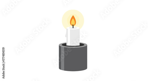 A lit white candle sits in a grey candle holder with a soft glow around the flame