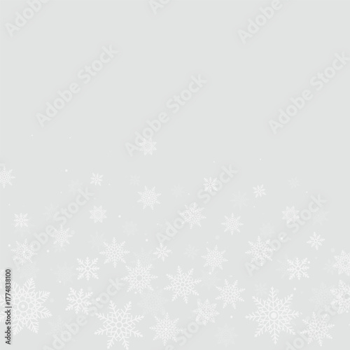 Christmas background with elegant falling snowflakes at the bottom. Perfect festive winter theme for greeting cards, invitations, wrapping paper, posters and holiday seasonal designs.