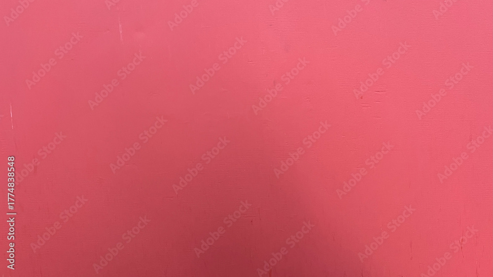 Fototapeta premium Bright pink wall background with smooth textured surface and minimalistic design