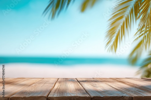 Wooden table with soft focus tropical beach and palm leaves, ideal for summer vacation promotions, travel backgrounds, and product presentation mockups