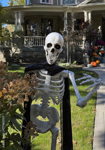 Halloween skeleton guard at suburban house