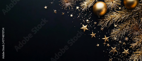Golden Christmas decor with branches, baubles, and confetti on dark background. Flat lay mockup for New Year and Christmas festive design projects.