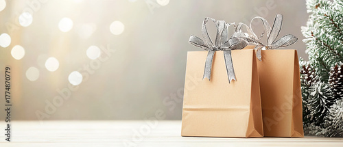 Minimalist composition with gifts and Christmas ornaments on bright neutral background. Modern winter decor in calm tones for elegant festive design.