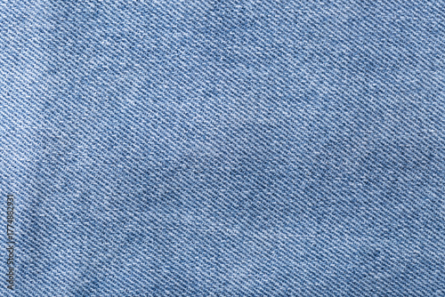 The denim is light blue. Denim background.