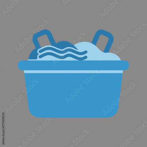 Blue basin filled with laundry and water.