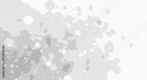 A delicate watercolor splash in varying shades of gray creates a soft, ethereal effect, perfect for adding a subtle artistic touch to designs and backgrounds.