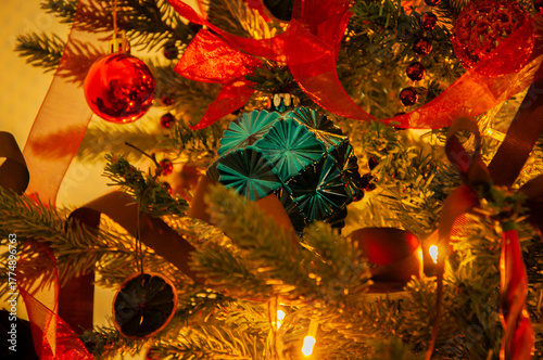 Colorful Xmas decoration on celebration tree at home party. December vibe. Winter happy holiday