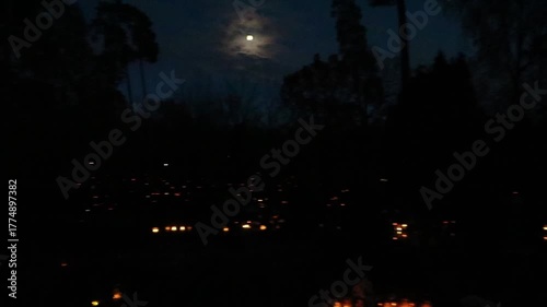Candles in cemetery at night time