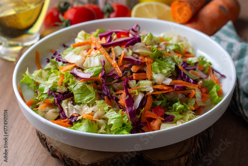 Turkish style lettuce salad. Diet salad with lettuce, red cabbage, tomatoes, and carrots.