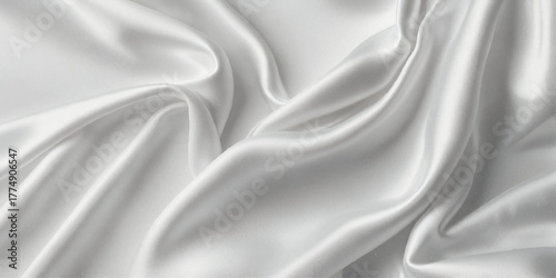 Luxurious close-up of a white satin fabric. A close-up view of a rich, deep white satin fabric, showcasing its smooth, flowing texture.	