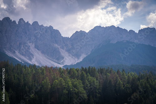 Dramatic Dolomites Ridge with Forest and Clouds, South Tyrol