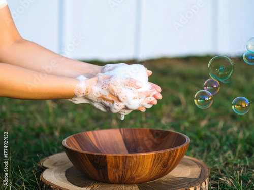 Person washing hands repeatedly with soap bubbles showing OCD behavior, obsessive compulsive disorder