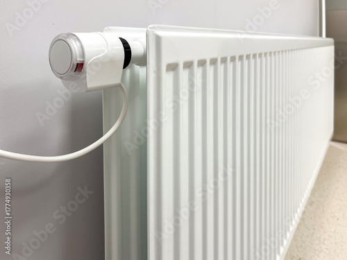Wallpaper Mural Modern radiator with a sleek valve and temperature regulation handle, showcasing a contemporary heating system in a minimalist environment, ideal for efficient heating solutions Torontodigital.ca