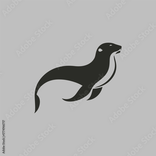 Silhouette style minimal sea lion t-shirt design featuring bold black vector art of a sea lion, perfect for ocean lovers, marine life enthusiasts, animal art fans, minimalist fashion admirers, and mod