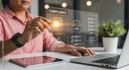 Woman interacting with digital compliance interface at modern office  