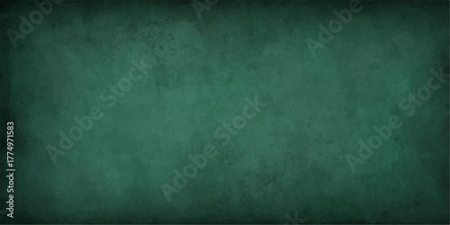 Dark vintage green chalkboard texture on a concrete grunge wall surface