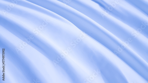 Soft, smooth light blue fabric background with elegant waves and subtle diagonal curves. Gentle folds of silk or satin texture.
