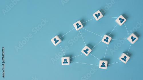 Canvastavla Connecting people partnership or men above social media networks on blue background concept using dice on blue background