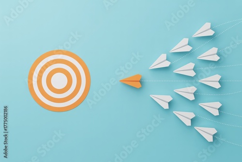 Leadership and goal alignment concept with orange paper plane guiding team to target on blue background.