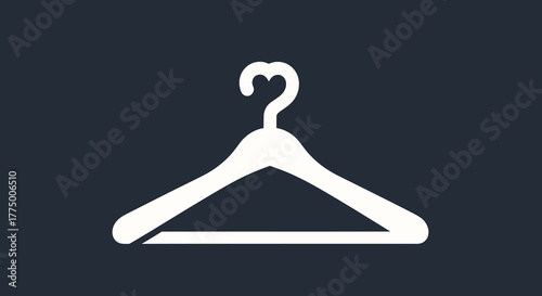 Minimalist wardrobe essential: a white hanger icon against a dark backdrop with elegant simplicity