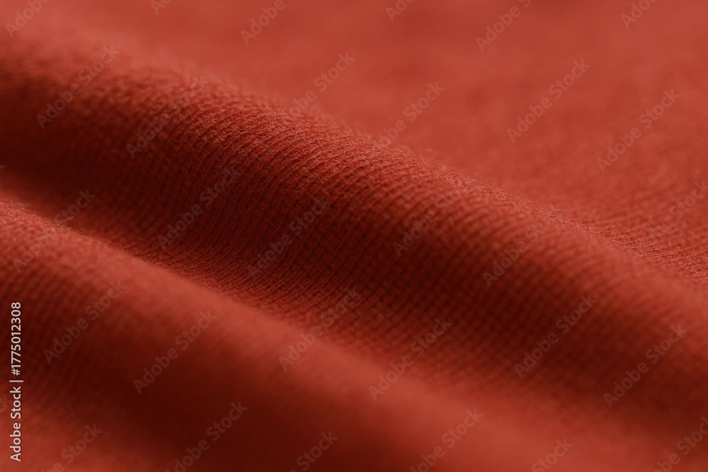 Fototapeta premium Close-up of Textured Red Fabric: Soft, Woven Material Showing Depth and Subtle Pattern for Textile Designs