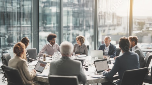 Team collaborates in modern office for strategic planning session in bright conference room