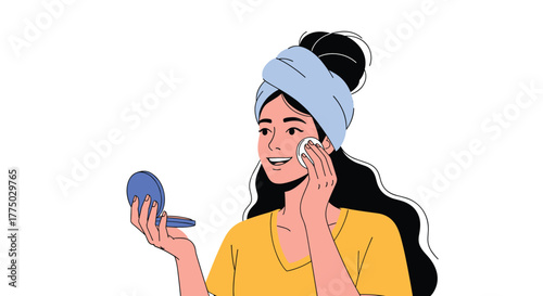 A smiling woman with a towel on her head applies a cosmetic product to her face with a cotton pad, holding a compact mirror.