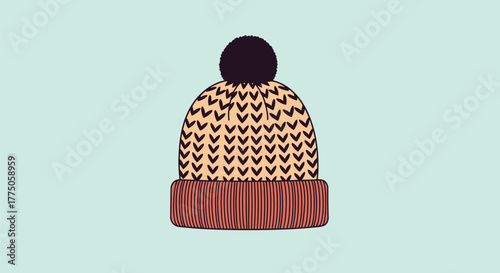A cozy knitted beanie hat with a pom-pom, adorned with a chevron pattern on the main part and a ribbed cuff, on a light blue background.