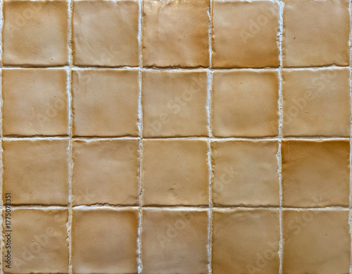 Close up  brown tiles, or beige brown porcelain mosaic tiles. Suitable for girly and feminine wall decoration, shops, bathroom and kitchen tiles. Vintage and art deco feel. Seamless background texture