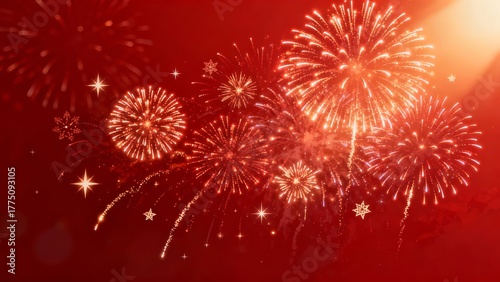 Vibrant red fireworks burst in a dazzling display against a deep crimson sky, creating a festive and celebratory atmosphere.