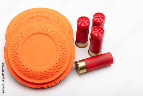 Clay shooting target and shotgun bullets on white background ,Clay Pigeon target game