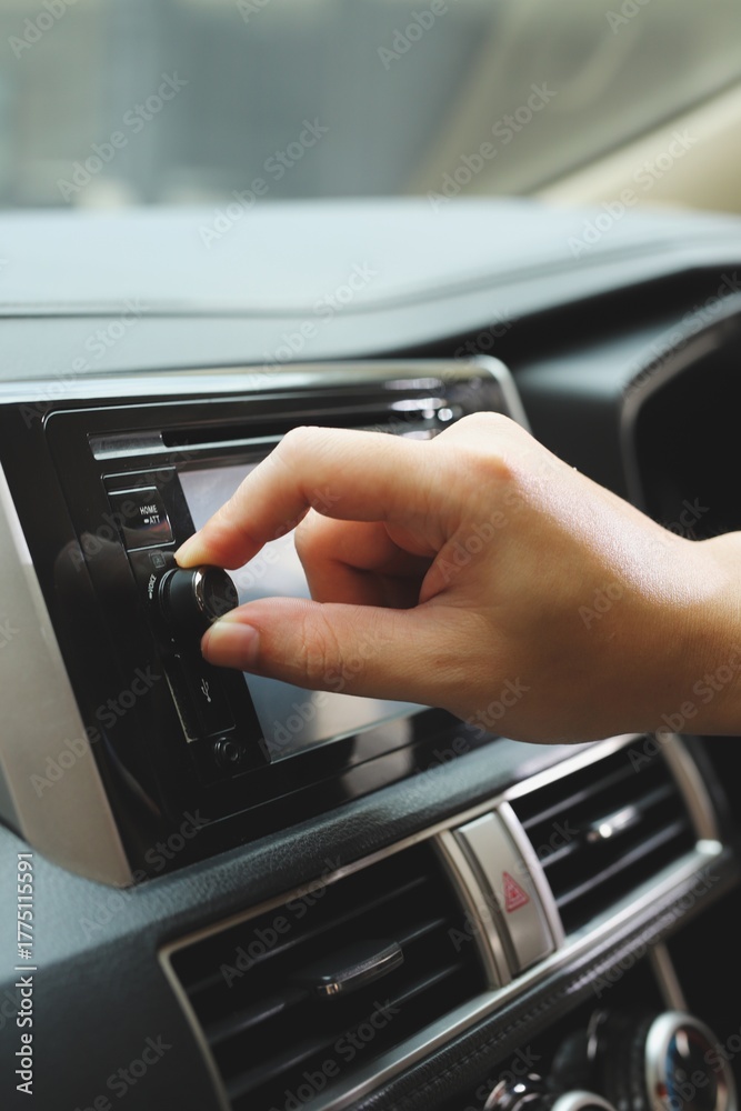 Obraz premium hand control car interior dashboard and steering wheel